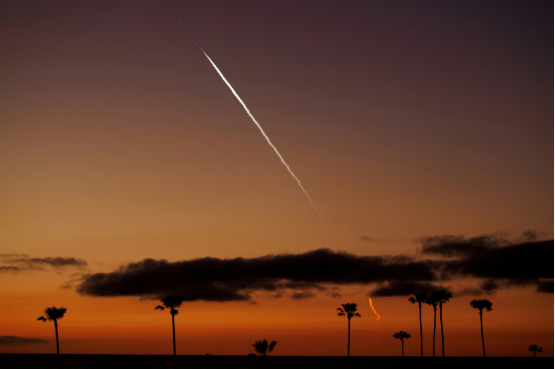 SpaceX rocket launching satellite into orbit